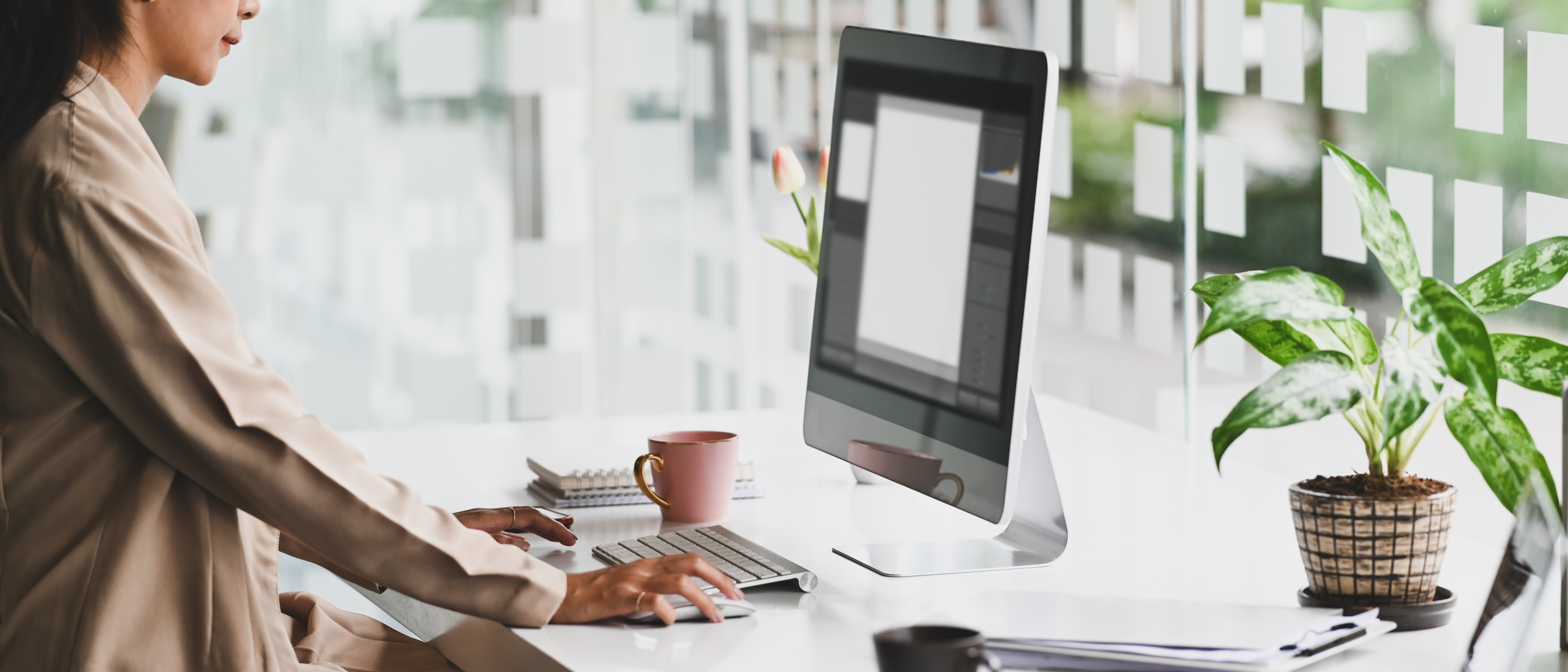 Woman Working on Computer Desk